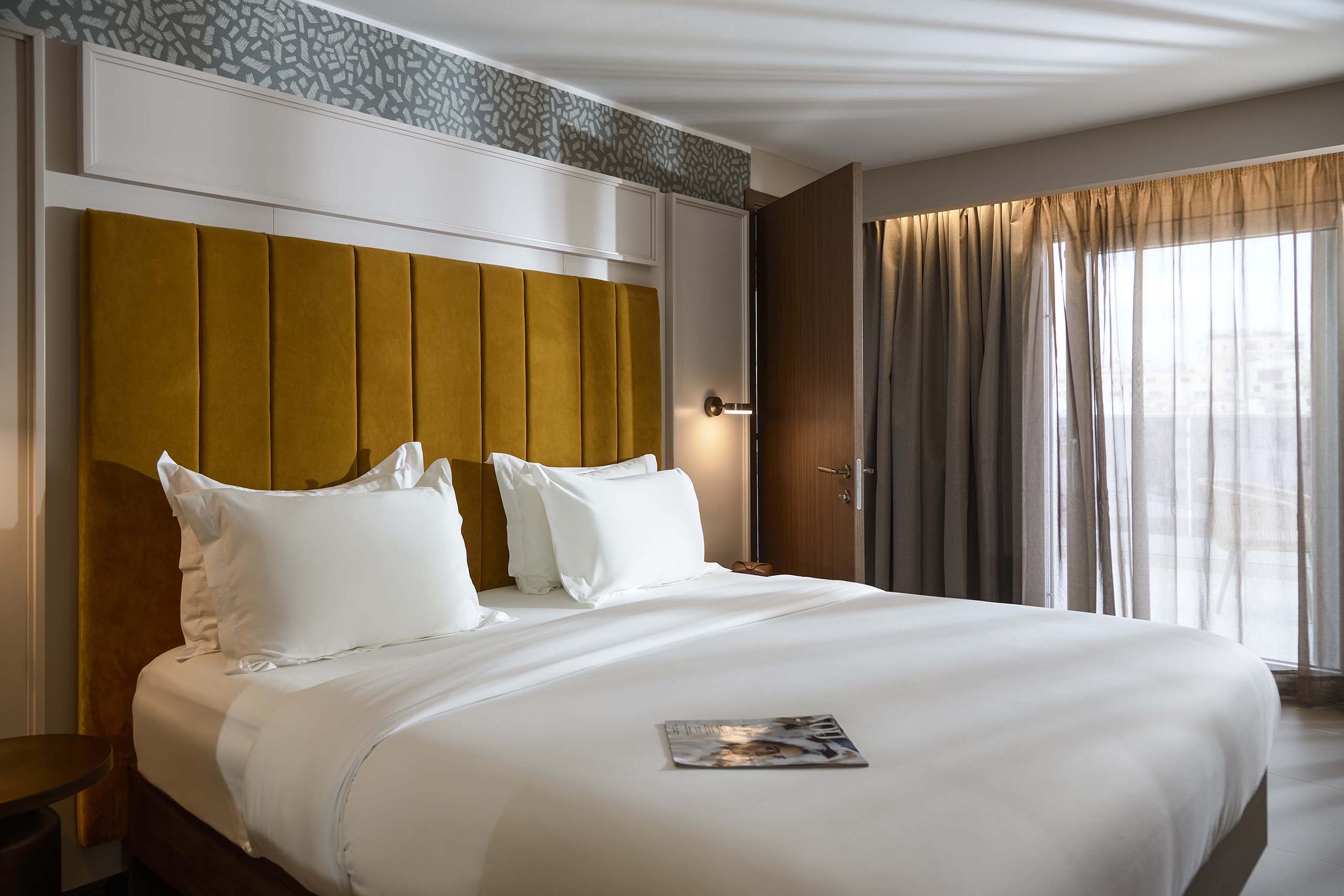 Luxurious bedroom with large bed.