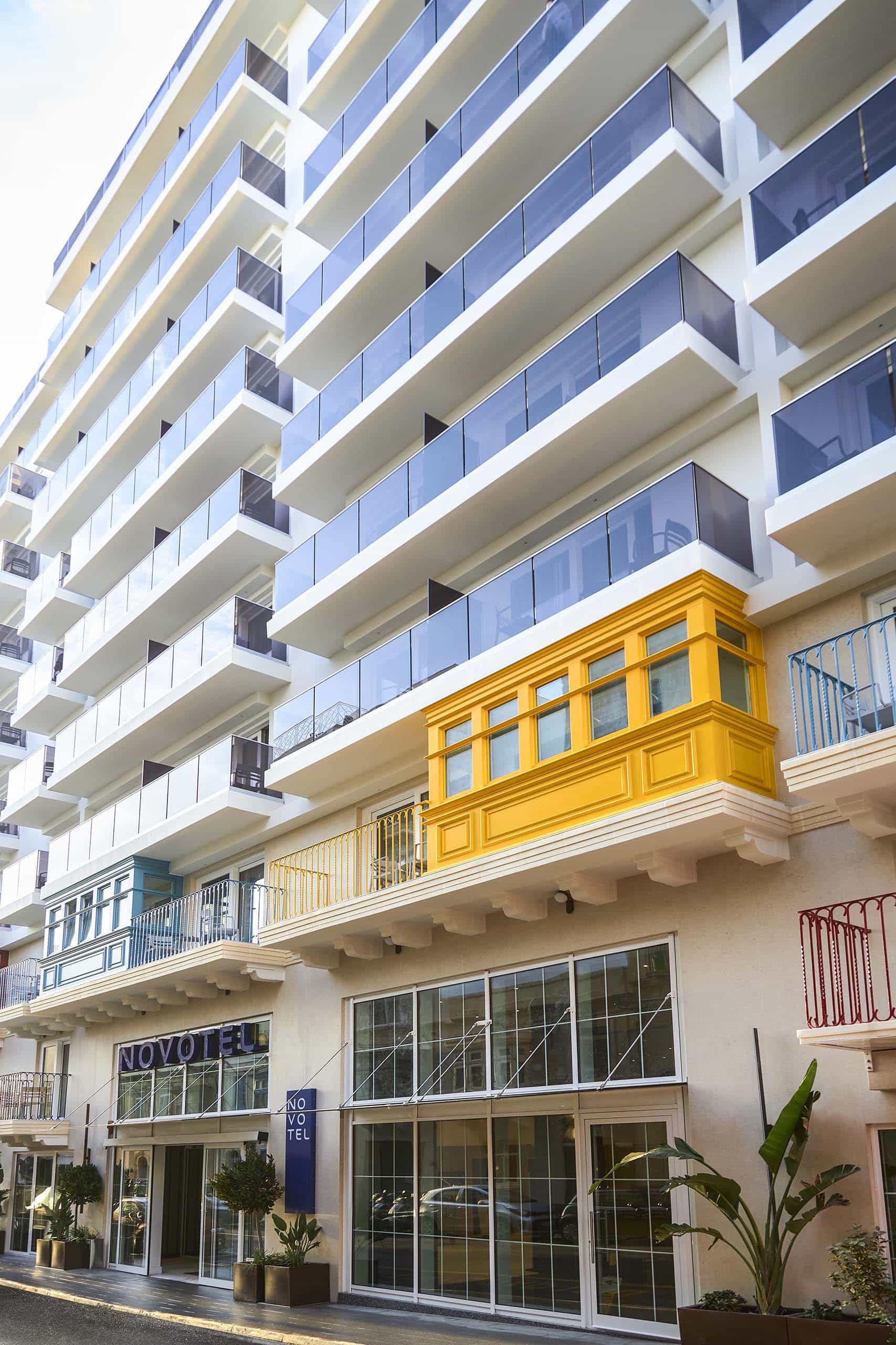 Modern hotel with colourful balconies.