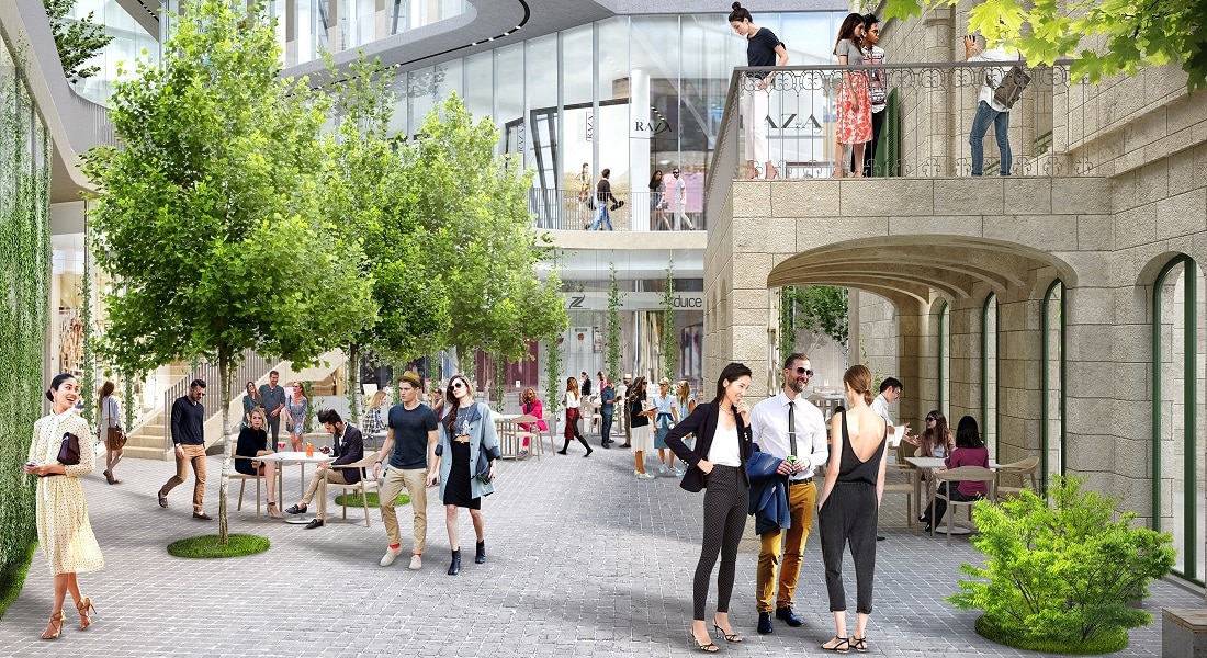 Modern shopping area with greenery and people